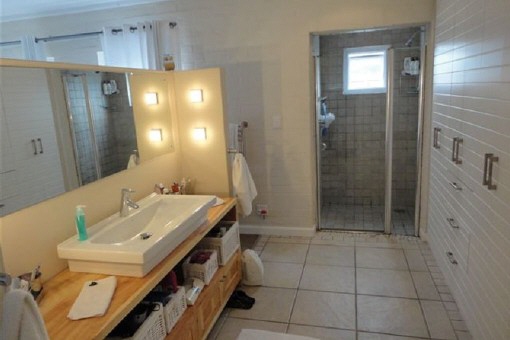 Bathroom with large wall closets and basin