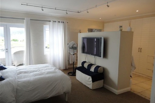 Bedroom with large wall closets