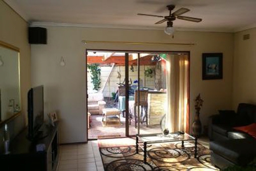 Living area with TV and access to the outside rest area